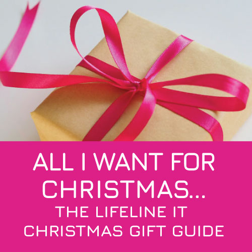 Present wrapped in gold gift paper and bright red satin bow