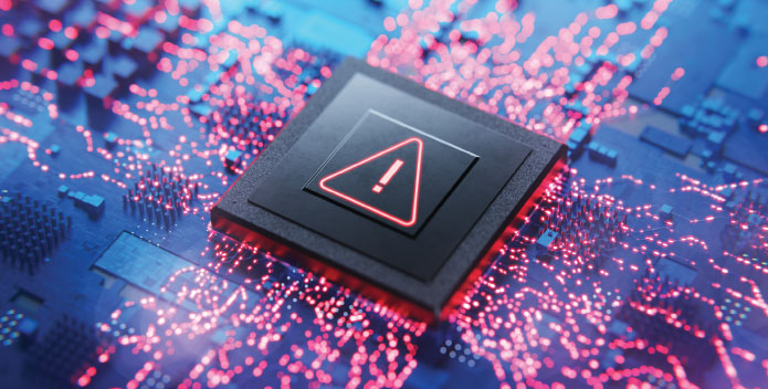 Large computer chip with warning triangle marking on circuit board with outward radiating circuits
