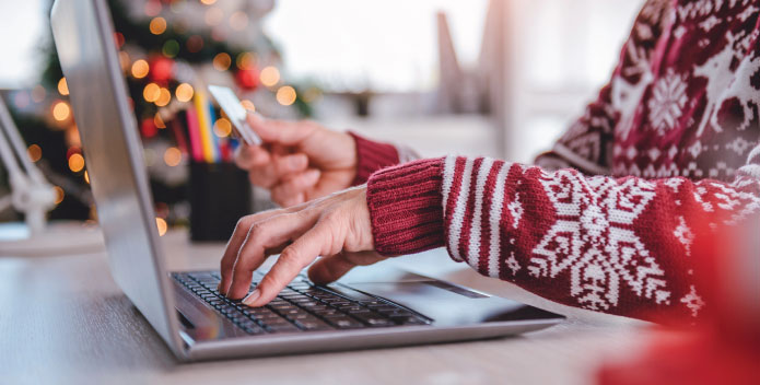 Cyber Crime - person doing Christmas shopping on a laptop PC