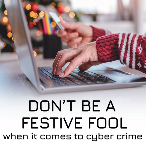 Cyber Crime - person doing Christmas shopping on a laptop PC