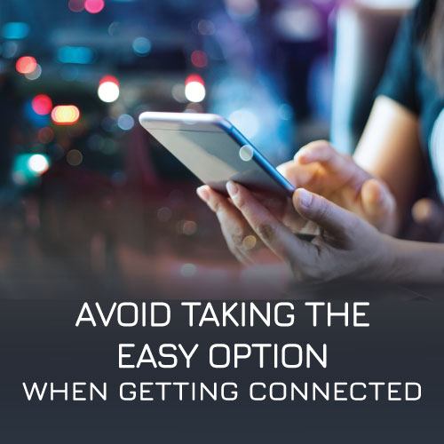 A person using their mobile in public to show public wifi dangers