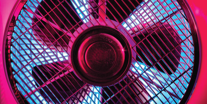 How to Keep your IT Equipment Cool - a large IT computer fan with metal mesh protector