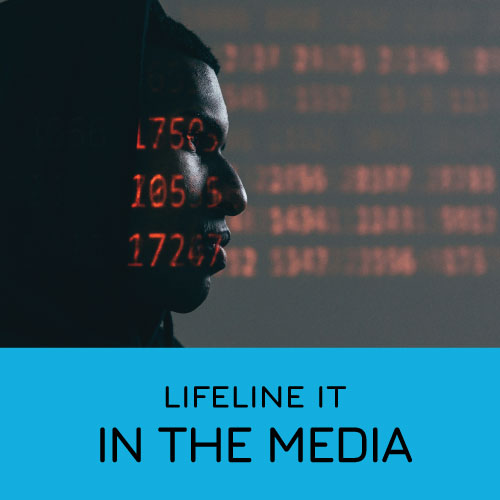 Silhoutte of a suspicious looking man with code projected on to his face to illustrate the need for Cybercrime Defence