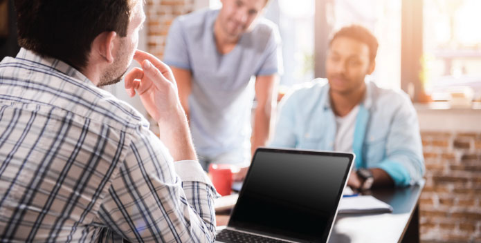 SME Cyber Protection meeting with 3 people in an office setting
